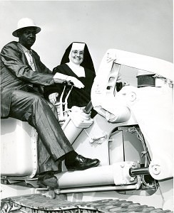 Mother Margarita doing construction with lay worker