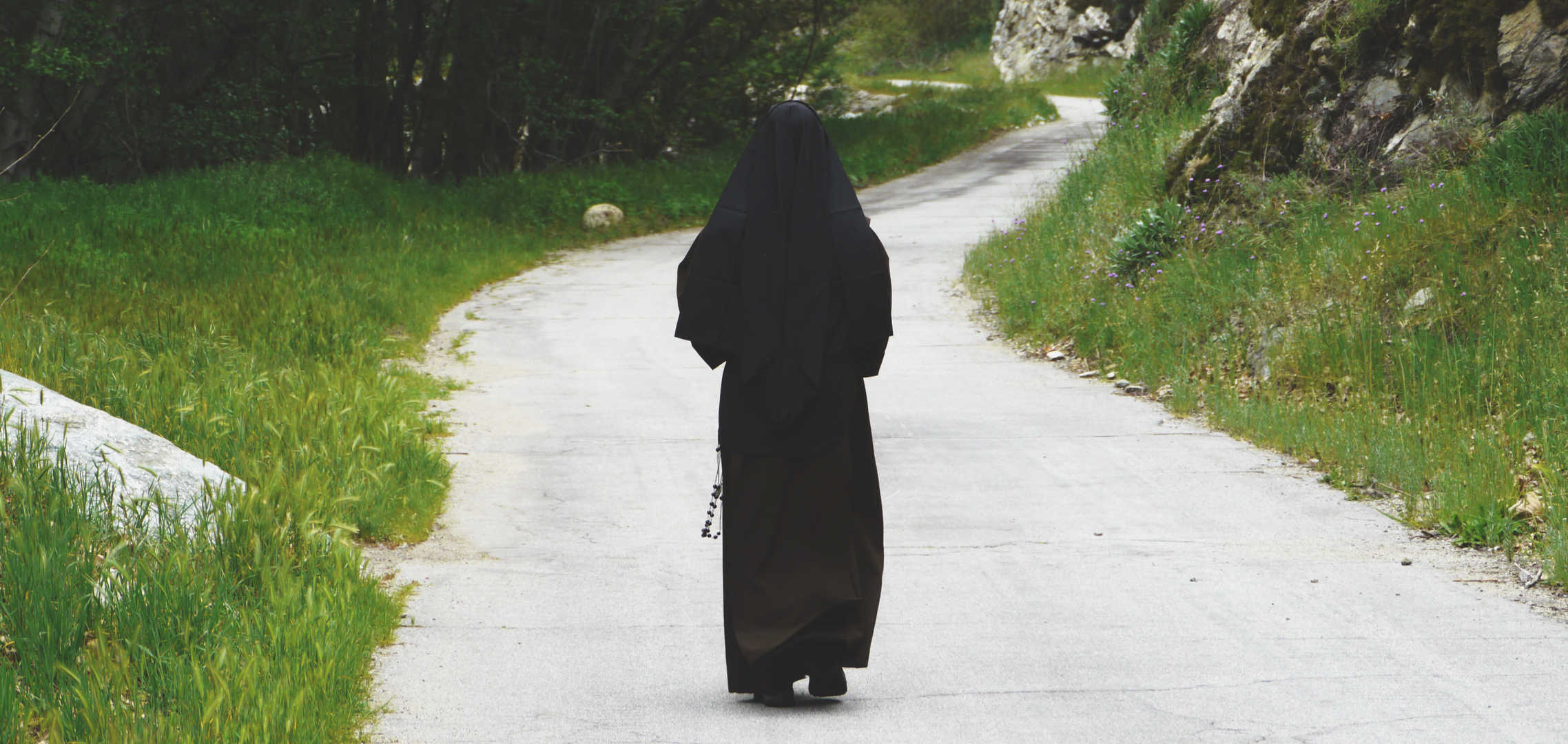 Sister walking down path in nature
