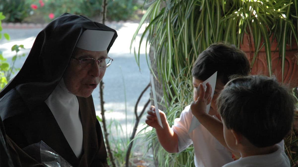 Sister interacting with children