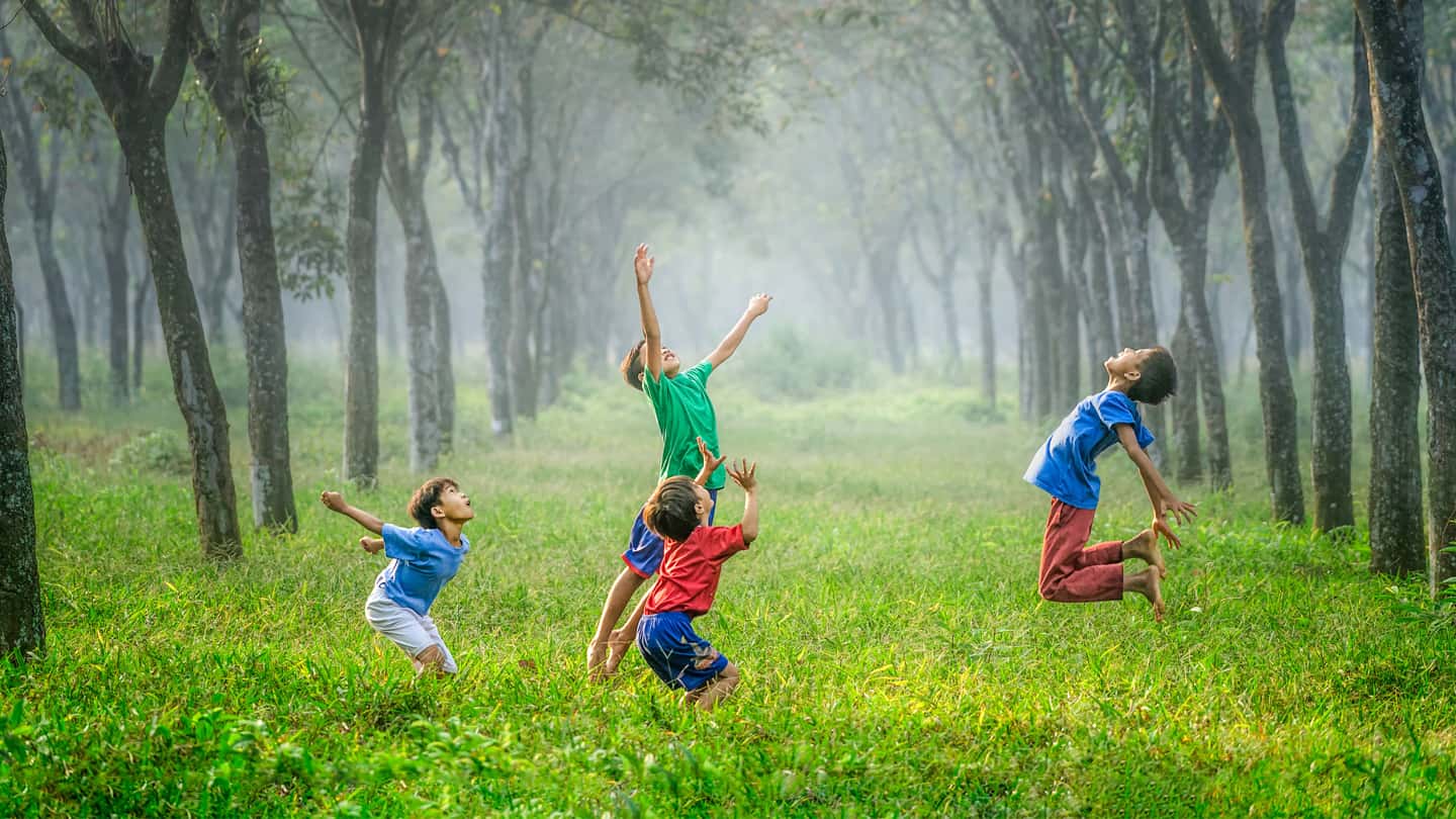 children playing in forrest