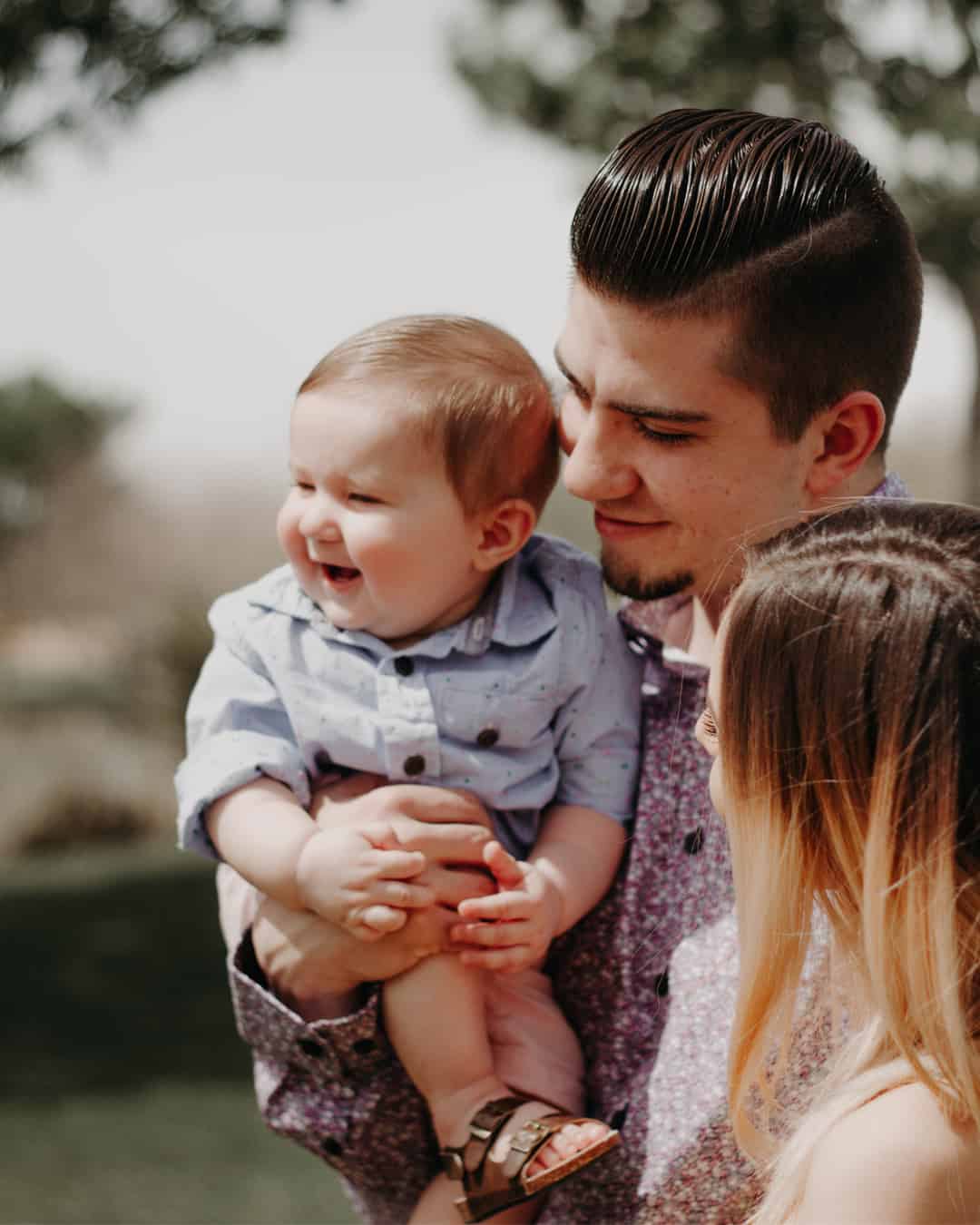 parents holding son portrait