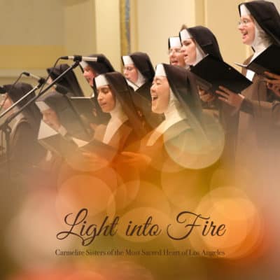 Light into Fire CD cover art. A group of sisters singing that fades into orange, yellow, and red circles.