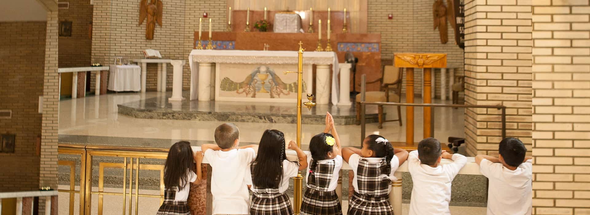 BelieveInGod children kneeling infront of altar