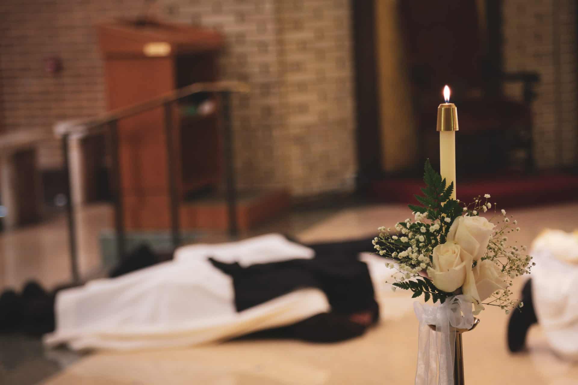 Sisters laying prostrate during final professions