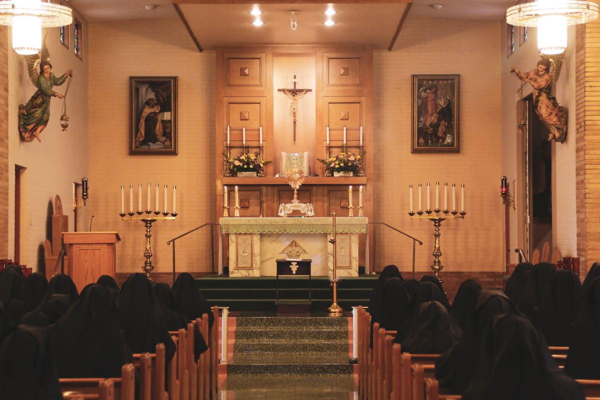 Sister praying in the chapel
