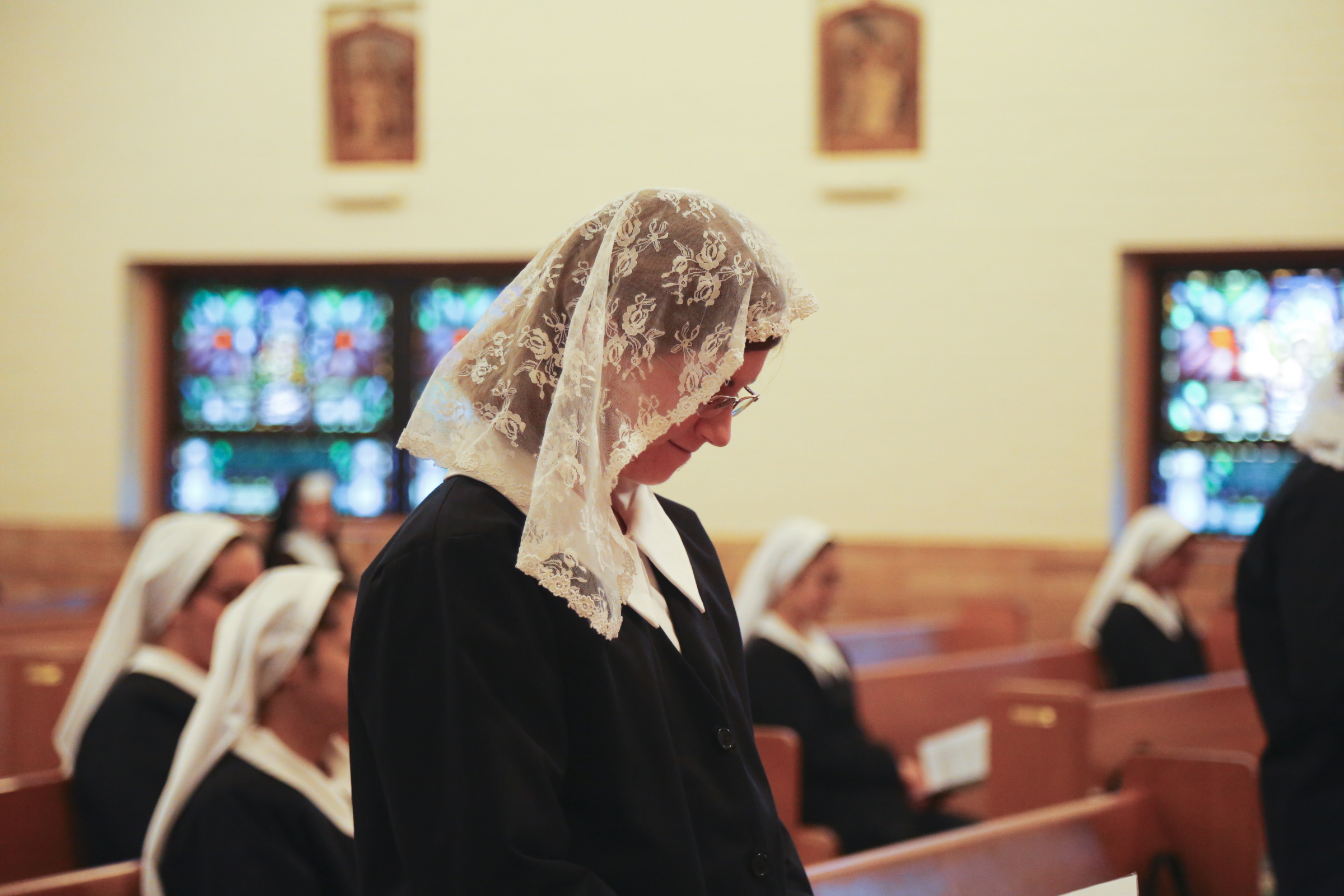 Postulant praying