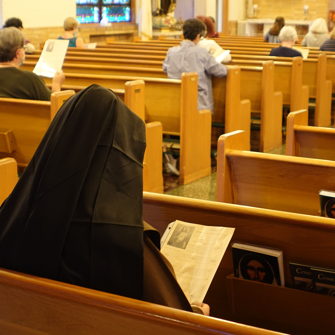 Sister sitting chapel and praying