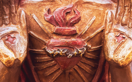 The Sacred Heart of Jesus with his palms facing the viewer.