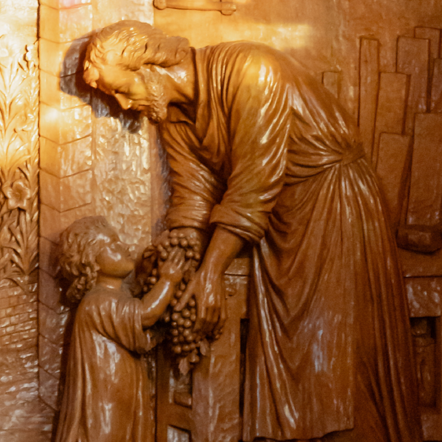 Wooden carving of St. Joseph and the child Jesus.
