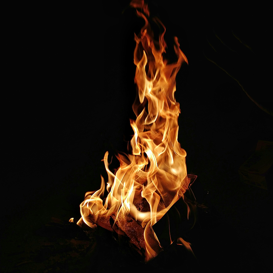 Fire against a pitch black background.