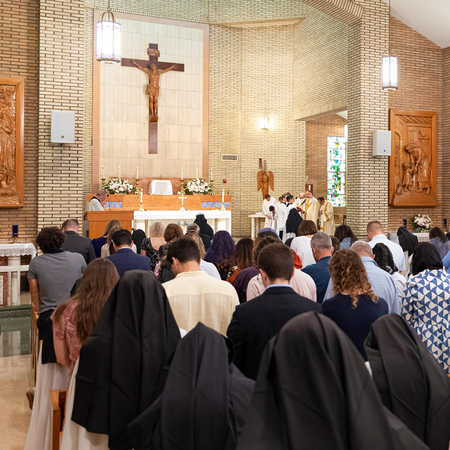 Sisters and lay kneeling in the chapel.